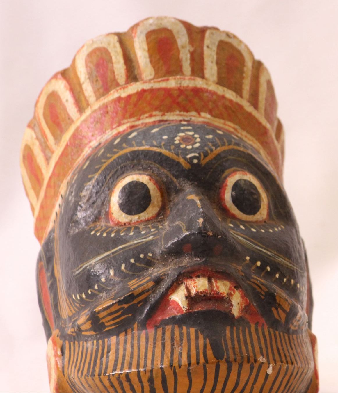 A head figure made out of paper mache
