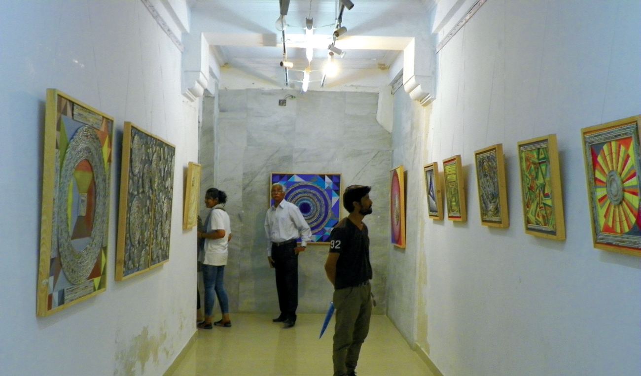 Visitors at an exhibition of her paper-roll paintings